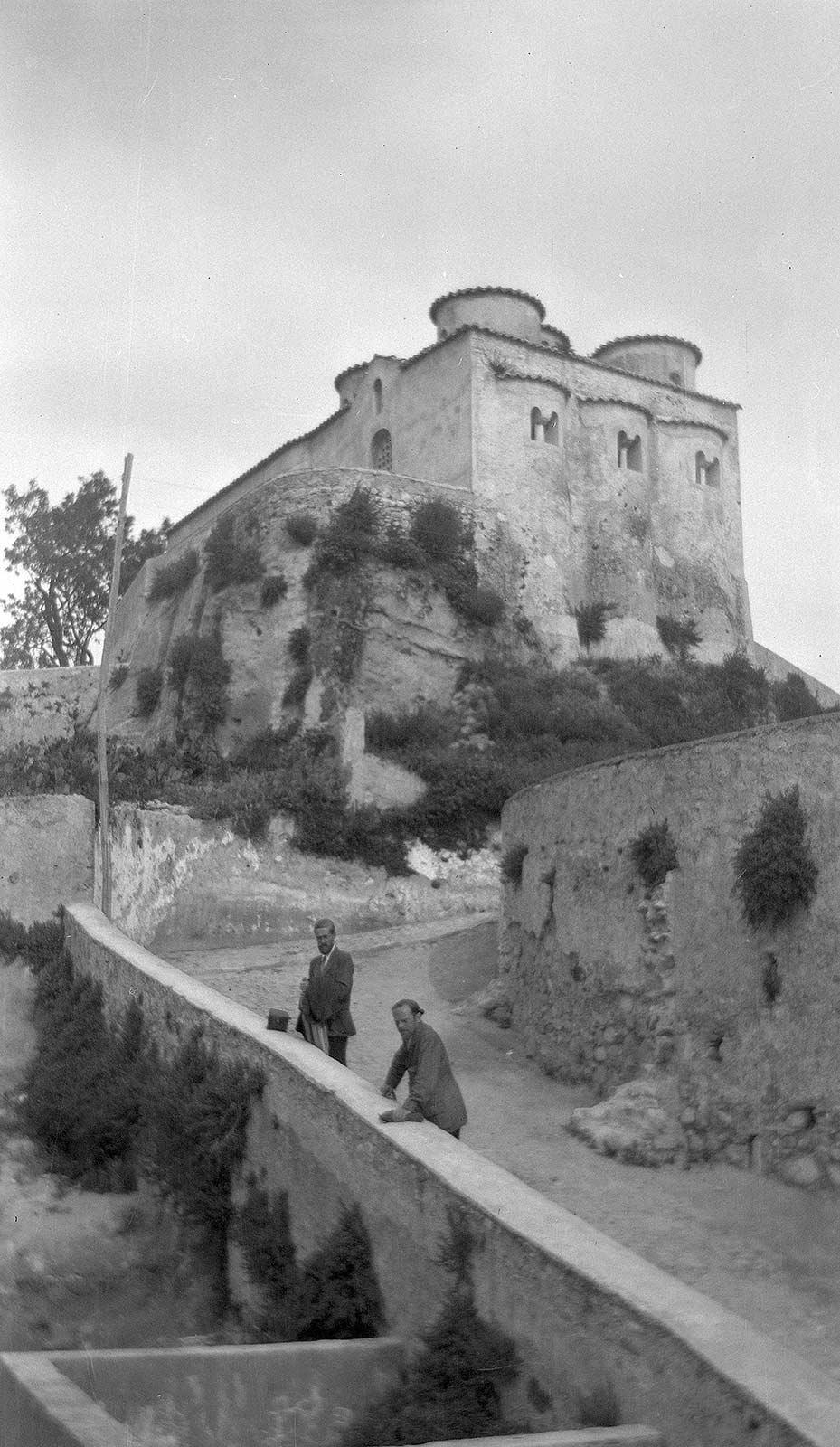 M.C. Escher and Giuseppe Haas-Triverio at Rossano, with the Oratorio di San Marco above them, 22 May 1930