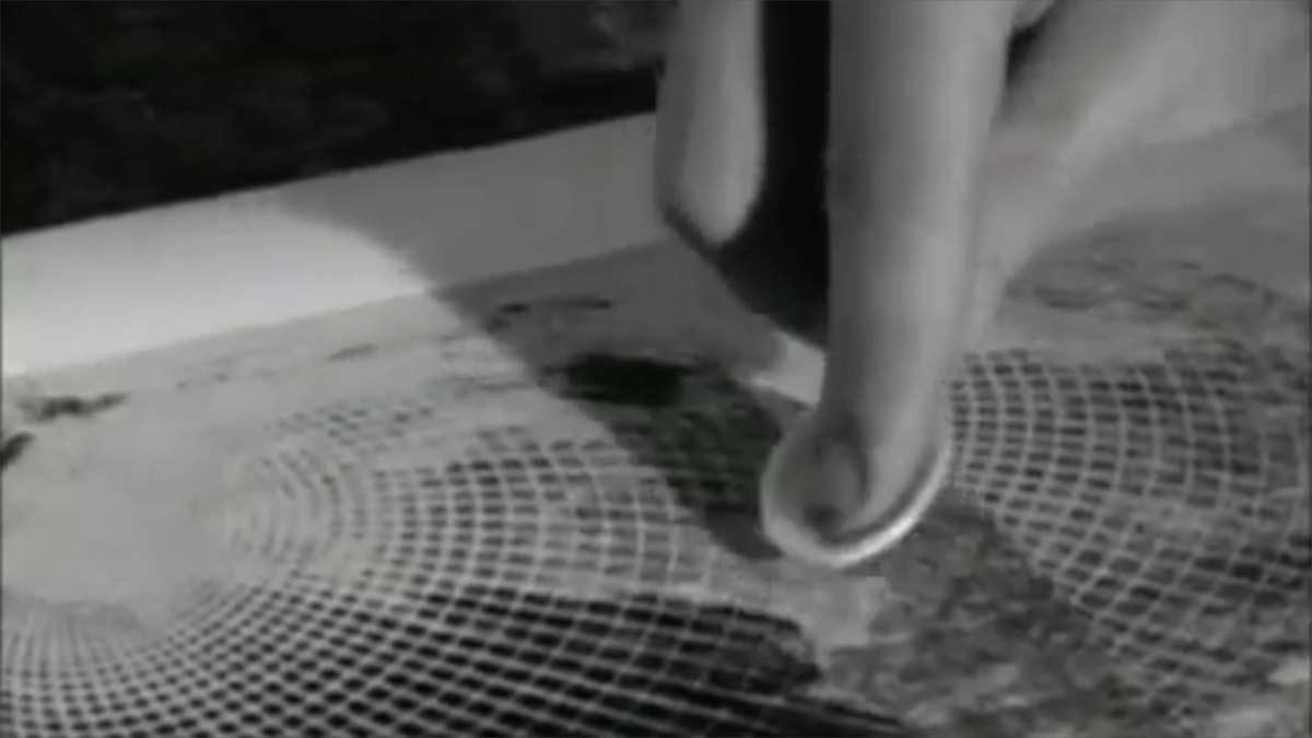 Escher working on his wood engraving Three Spheres I, filmstill.